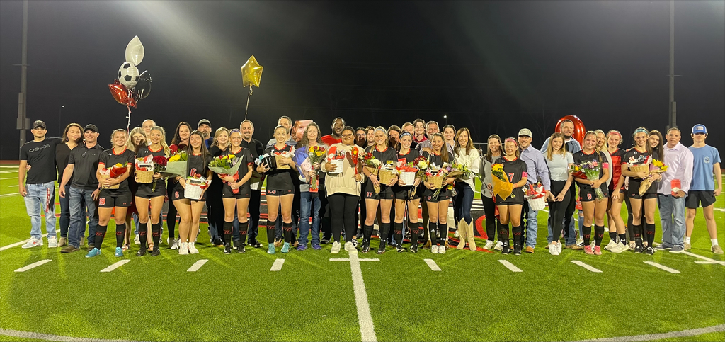 Lady Raider soccer seniors on the pitch for senior night with their loved ones