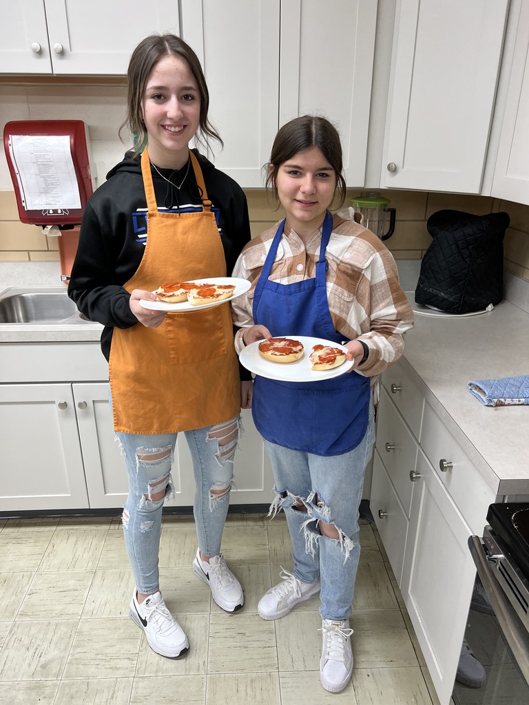 Two girls at TMS with their prepared dish.