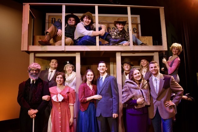 musical cast members on stage