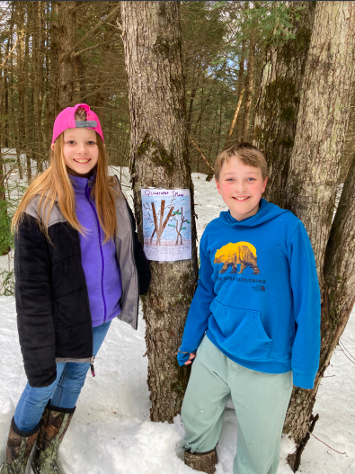 Students with nature poster