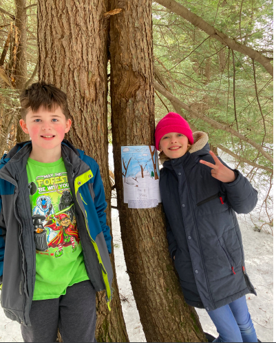 Students with nature poster