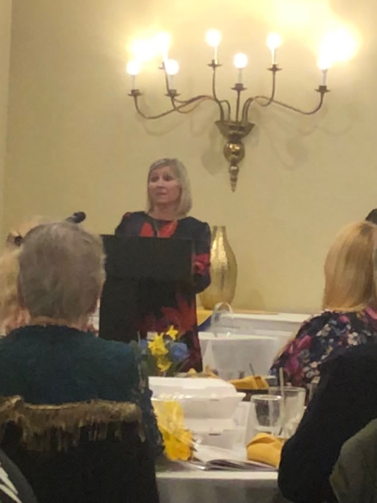 Mrs. Tannock receiving her award