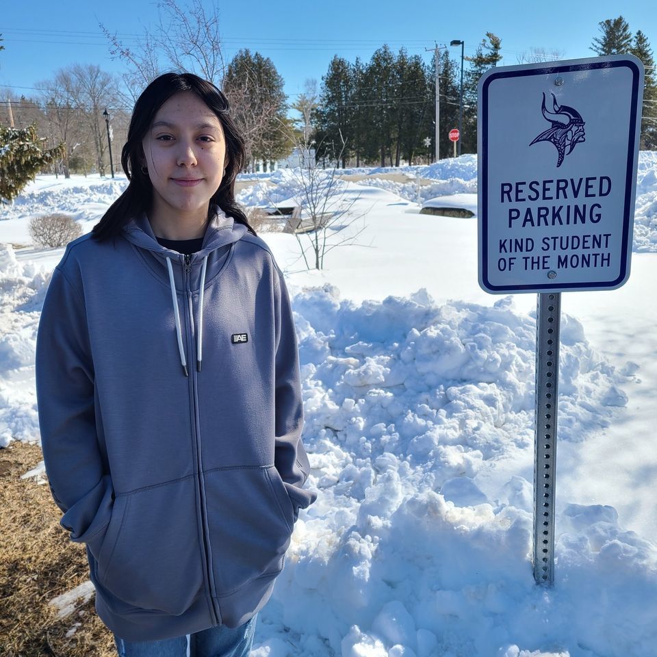 student with reserved parking spot for kind student of the month