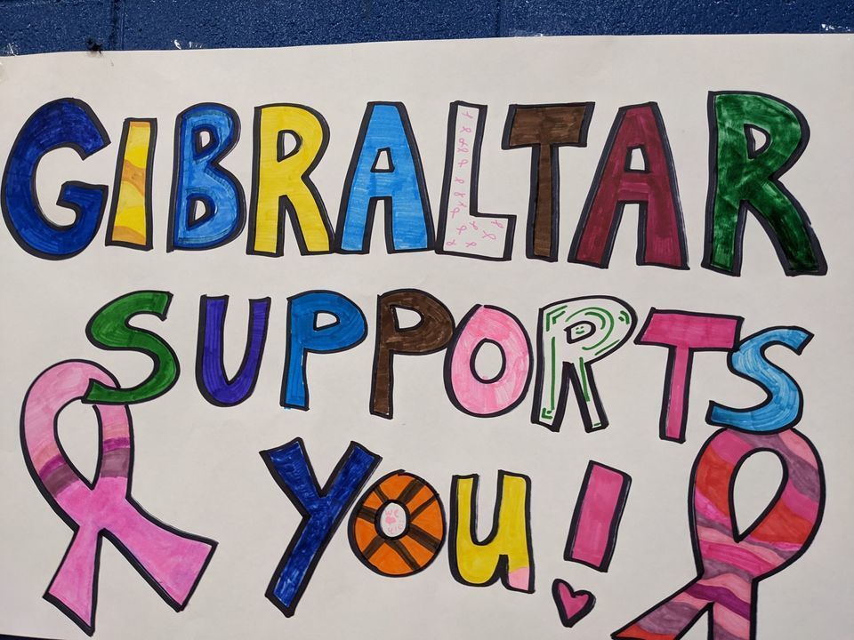 sign saying gibraltar supports you! with ribbons on the side