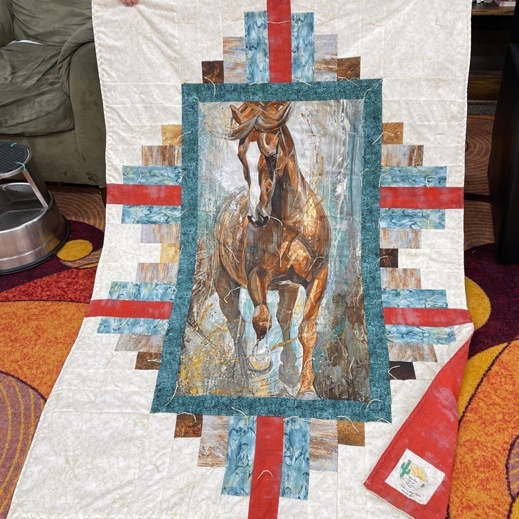 student with quilt
