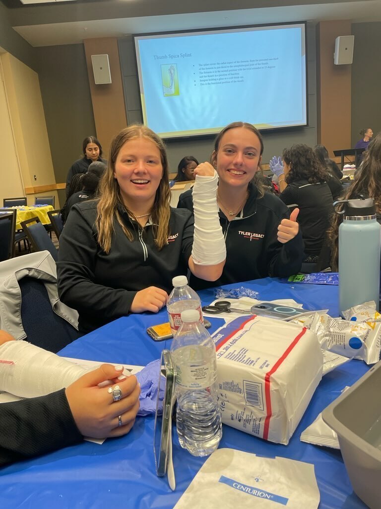 Legacy athletic trainers learning how to cast a broken bone