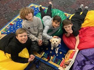 students read to a dog.