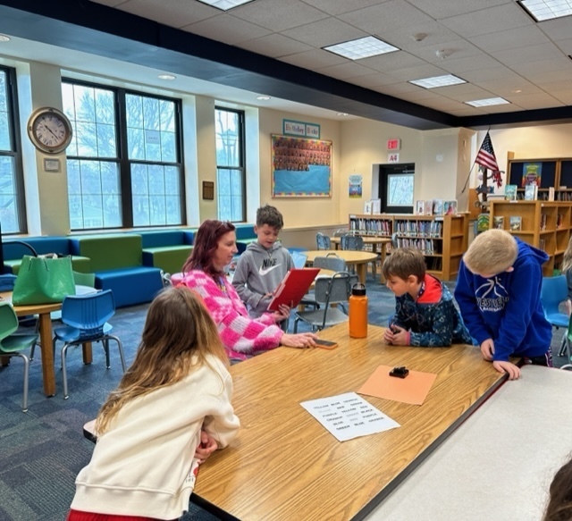 Wilson first grade students completing a neurodiversity station activity with a district behaviorist