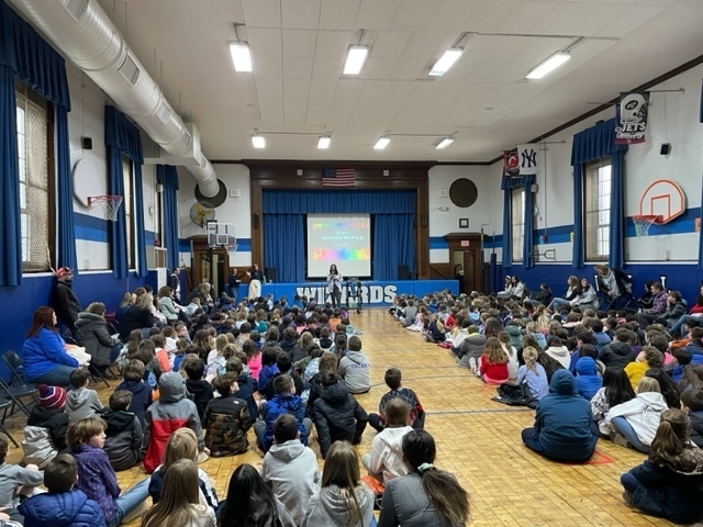 Wilson student body listening to the principal during the neurodiversity week wrap up assembly