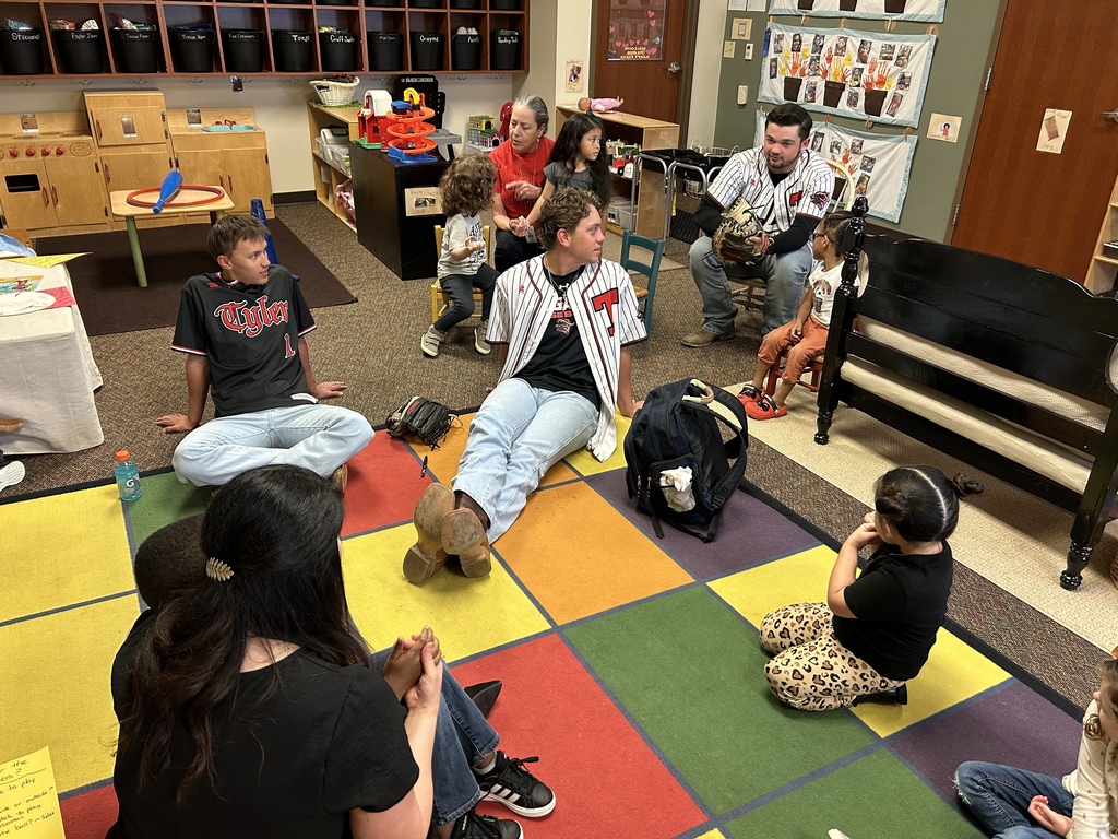 Legacy baseball players at Jones ES teaching students in Ms. McWain's class about baseball
