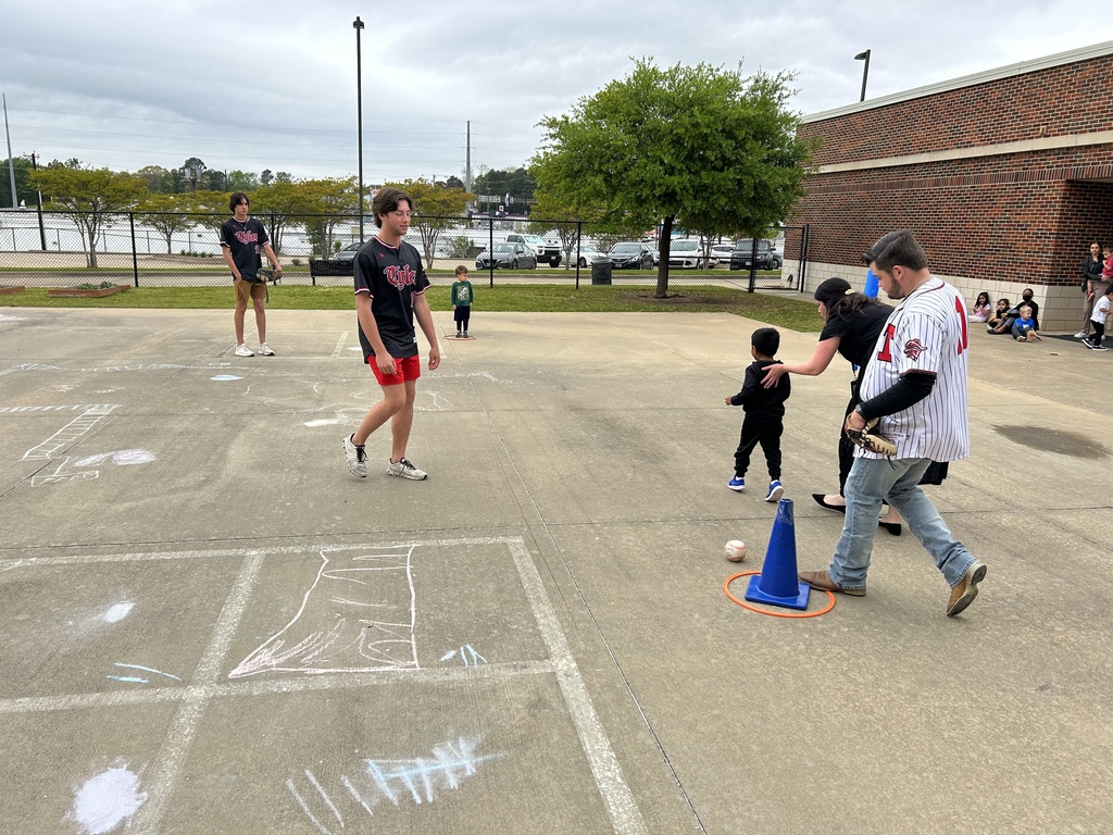 Legacy baseball players at Jones ES playing baseball with students in Ms. McWain's class 