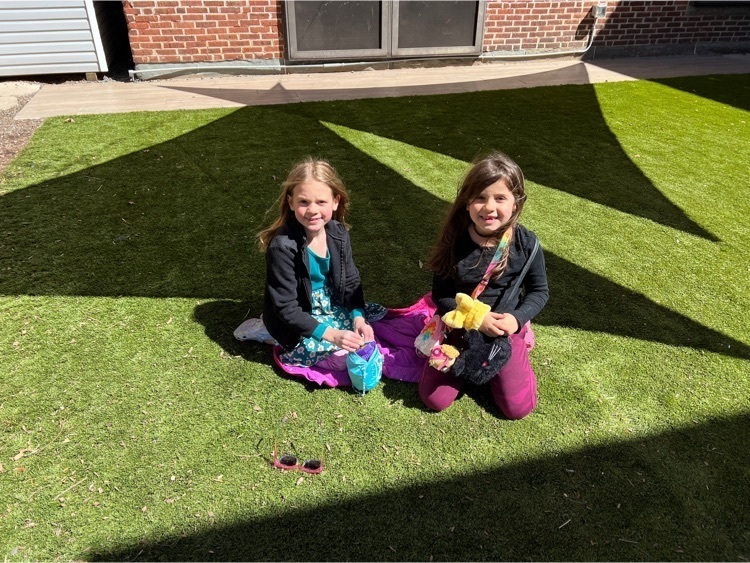 two girls hanging out in Megan’s garden