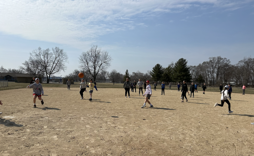 Students playing kickball