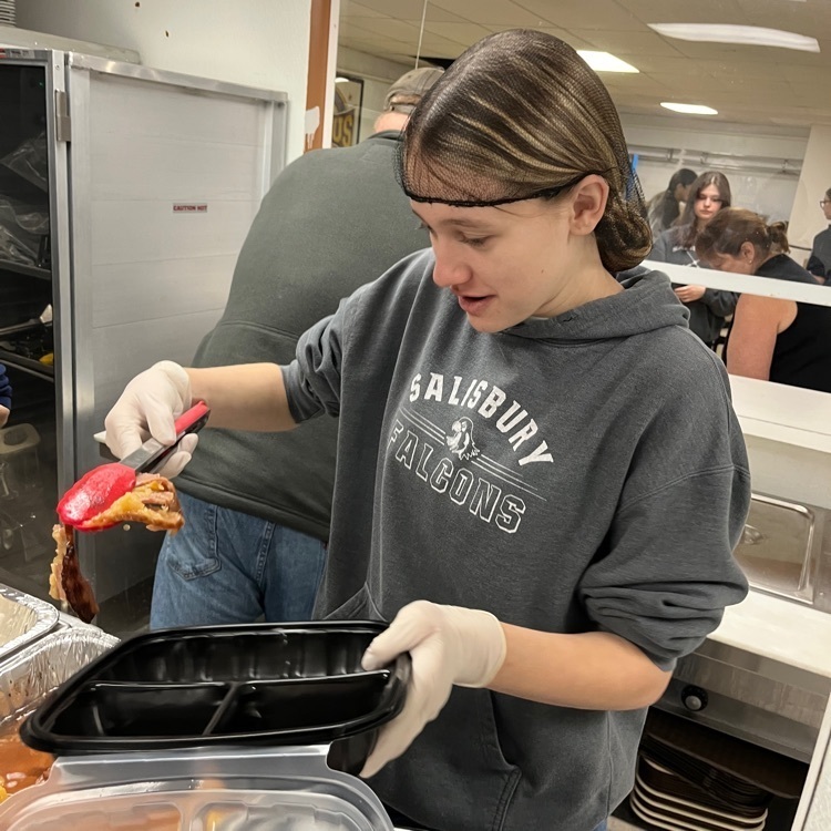 Sara dishing out ham