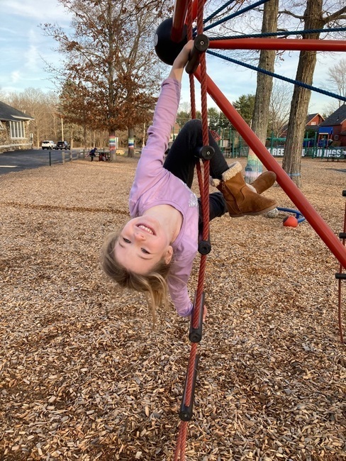 child on play structure