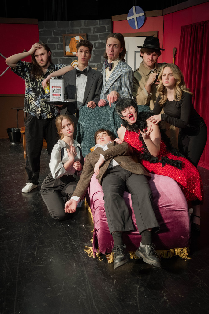 he cast of Mid-Prairie's production of The Play That Goes Wrong: (back, L-R) Jeremiah Rempel (Trevor), Jacob Carrill, (Dennis), Haydon Bailey (Max), Jack Greiner (Chris). (Front) River Gehling (Rachel), Logan McClellen (Jonathan), Avery Slaubaugh (Sandra), Caroline Schrader (Annie).