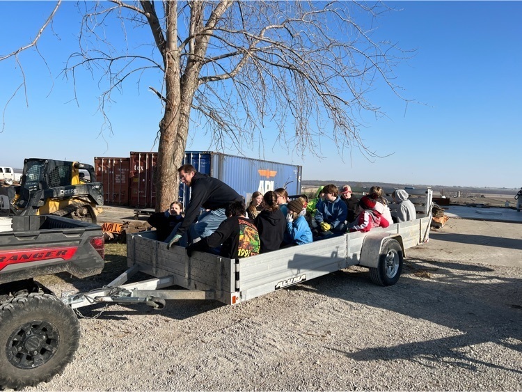 students cleaning up tornado debris