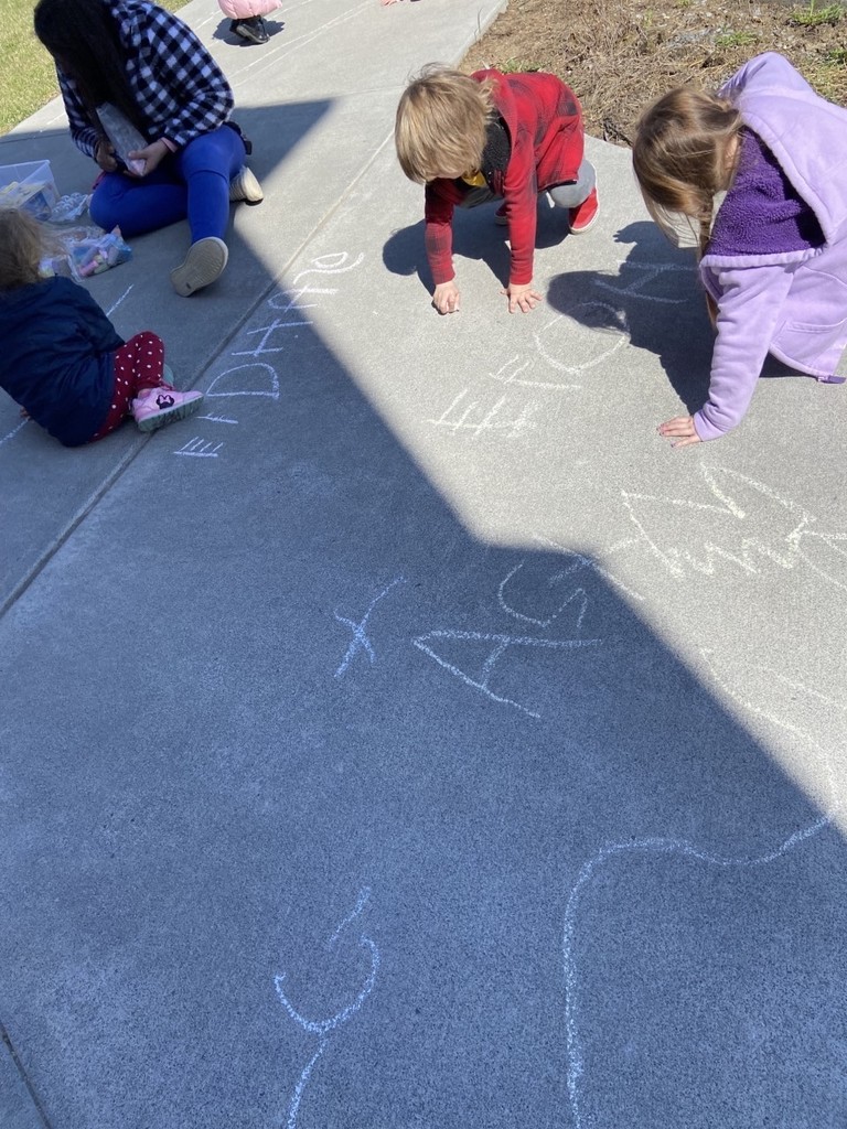 students drawing with chalk