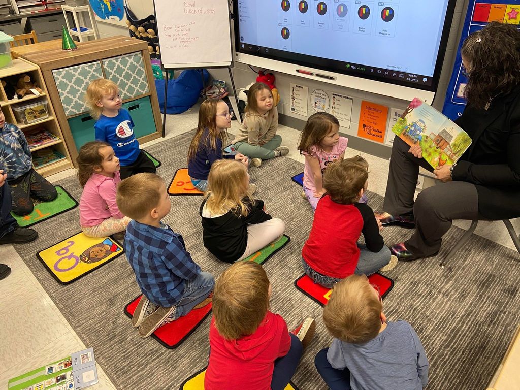 Mrs. Harden reading a book to PK class