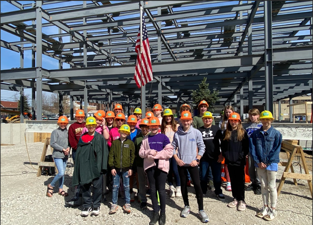 group in front of construction