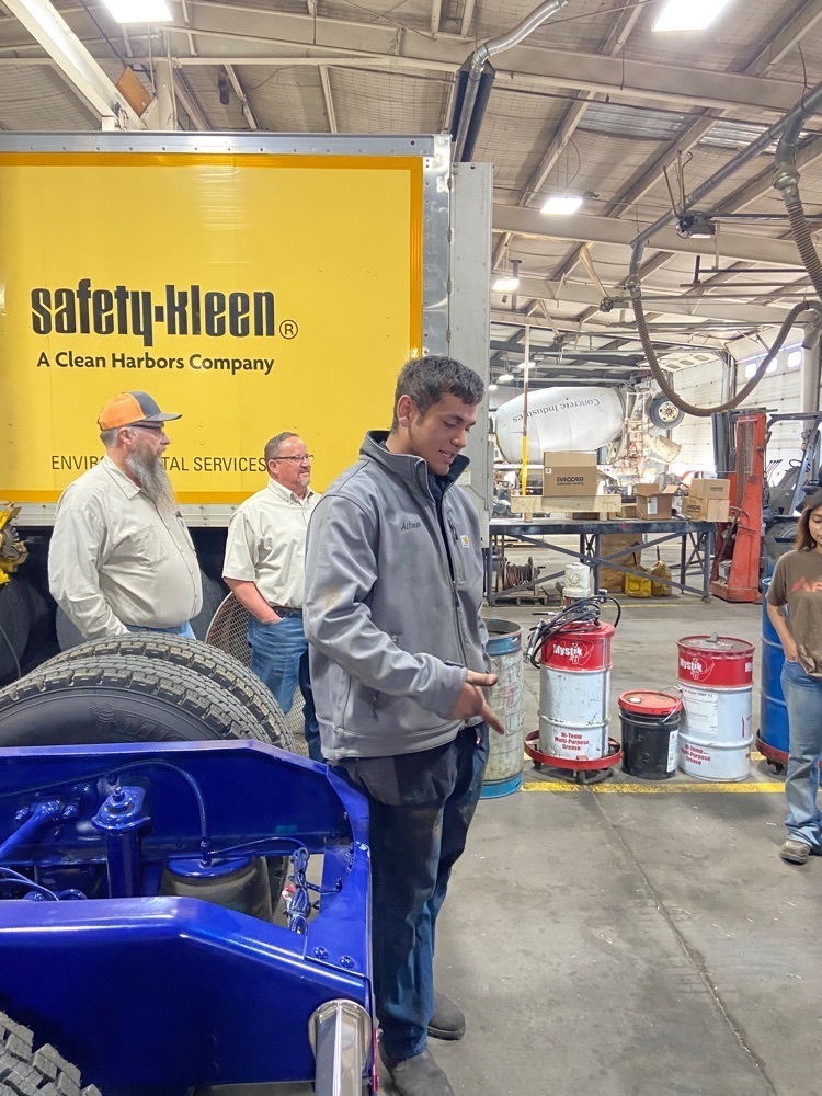 Service Manager Tyler Vanatta, Sales Manager Balta Peña and Sonnie explaining the service part of the business.