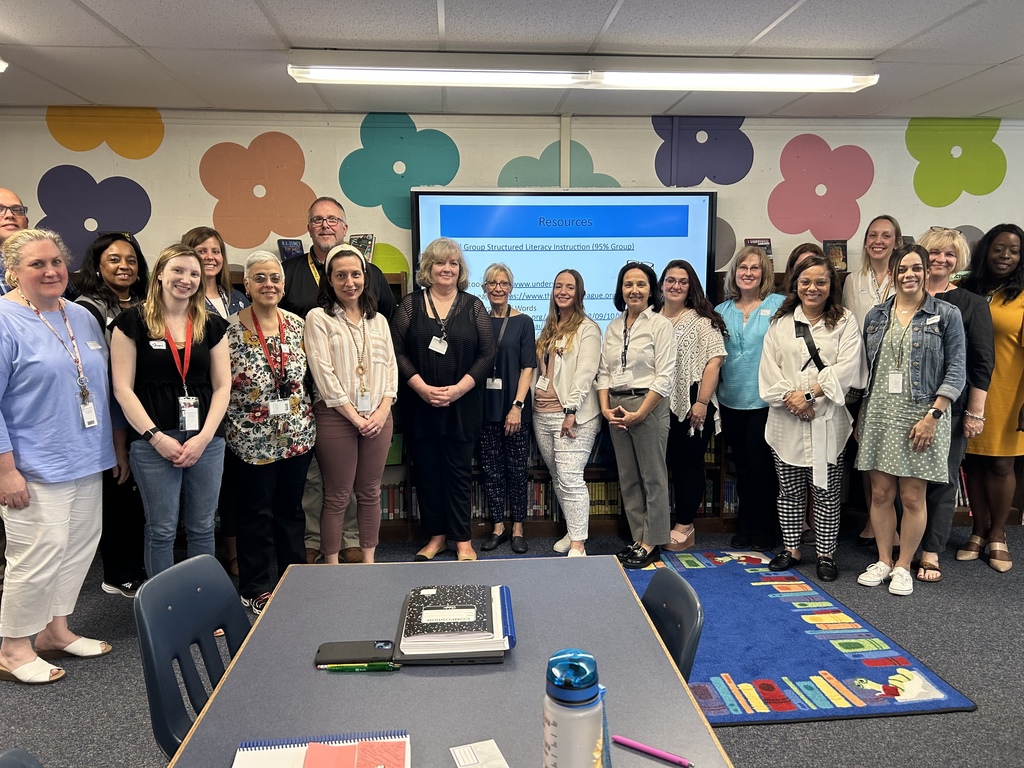 Group photo in front of smart board