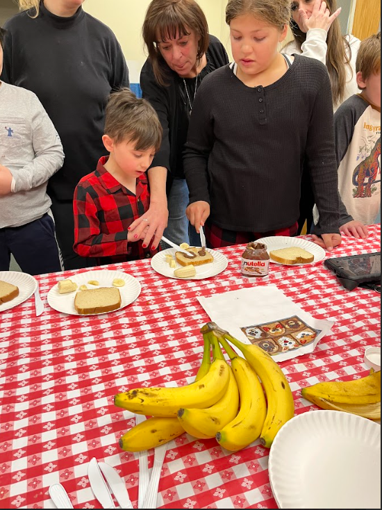 Grade 4 students helped with a cooking lesson in Mrs. Feeney's classroom at James Clark!