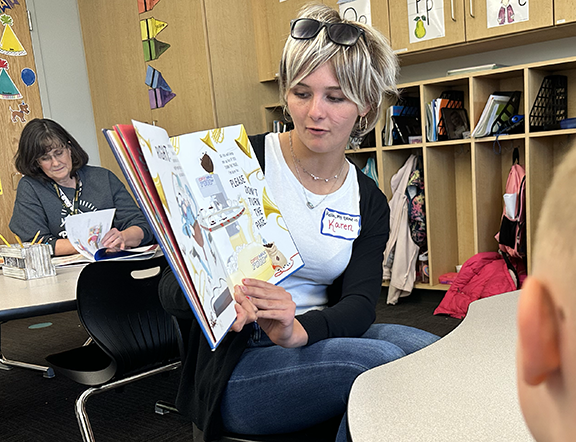 prom queen candidate reading to Blackmore students