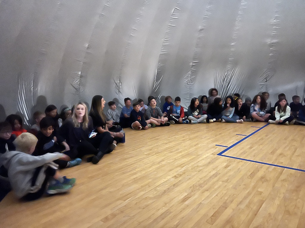 Students and teachers inside the SkyDome.