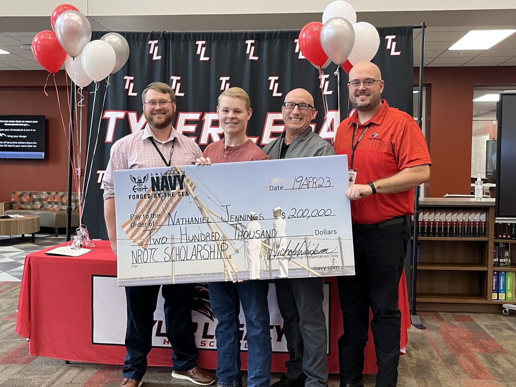 Legacy student Nate Jennings with Mr. Loeffler, Mr. Horner, and Mr. Labordus and his scholarship check