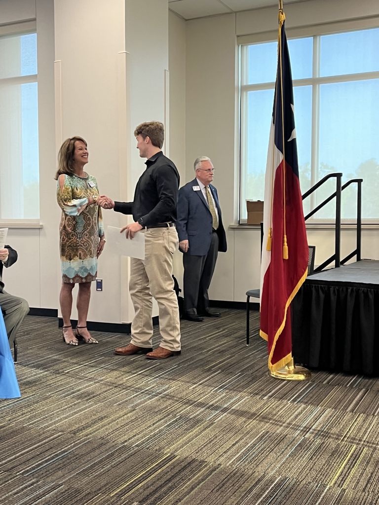 Legacy student Luke Youngblood getting his Rotary Young Citizens Club certificate