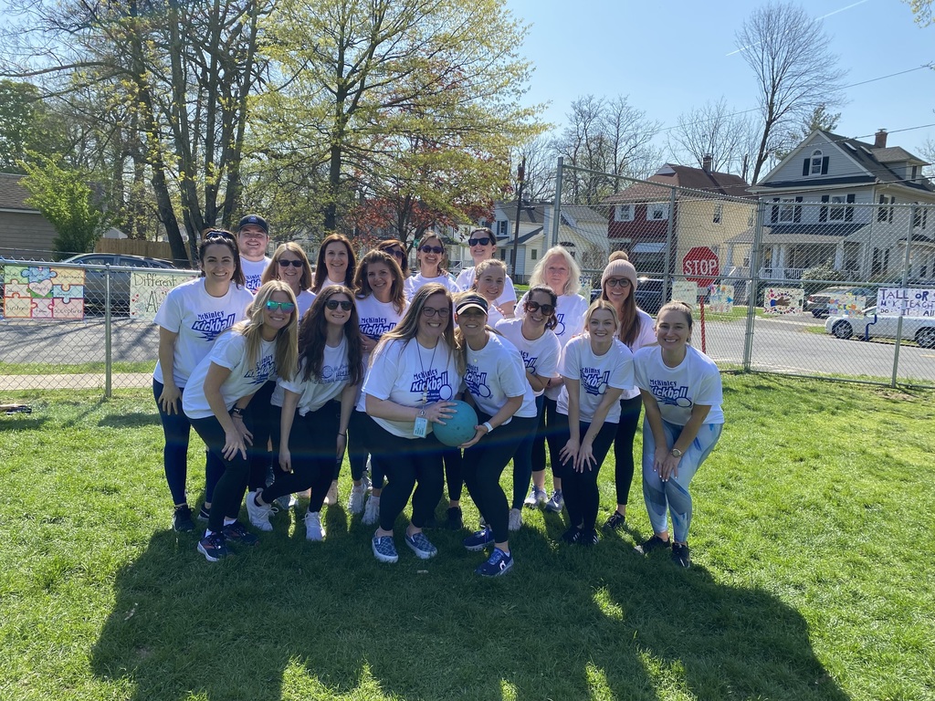 McKinley Staff members who played kickball pose for a shot.
