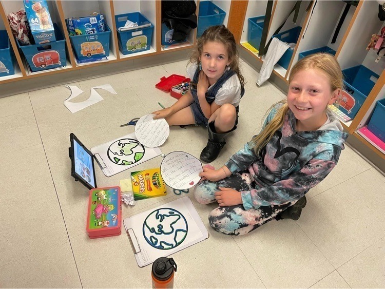 Elementary students learning ways to keep the earth healthy. 