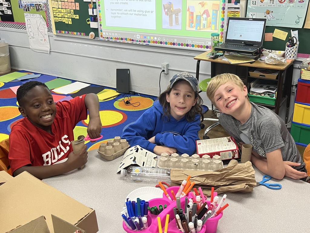 Three boys work together on upcycling project for Earth Day