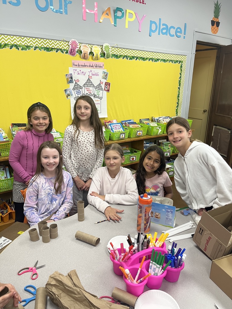 Girls work on a project in their classroom.