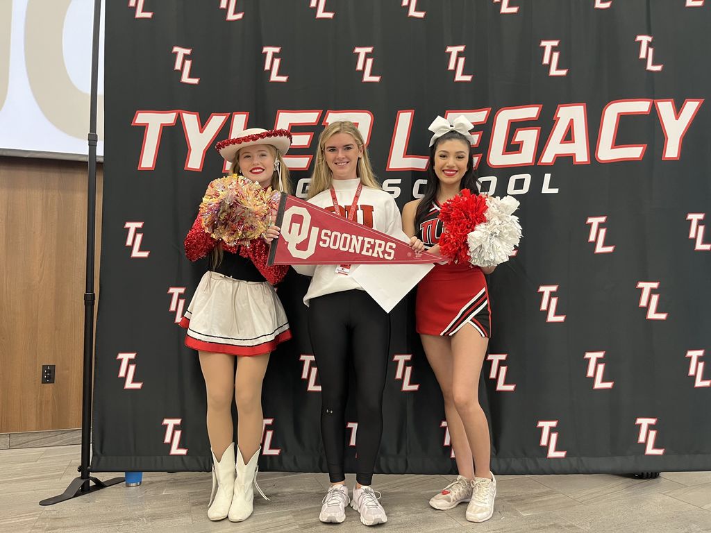 Legacy senior Avery Armstrong holding an OU pennant on Decision Day