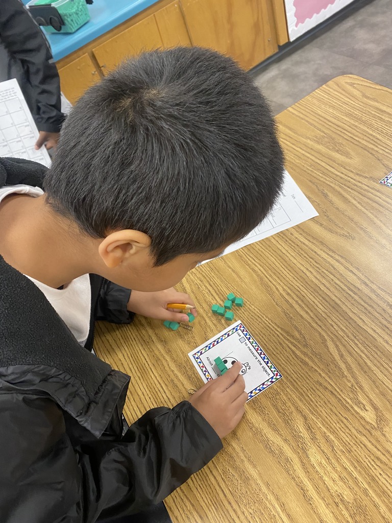 image of student working with measuring