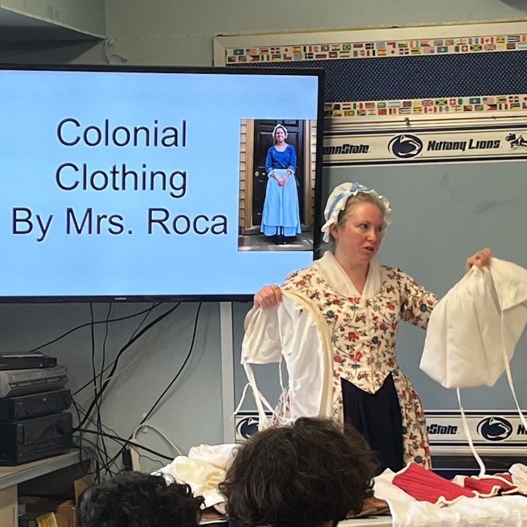Mrs. Roca explaining colonial clothing 
