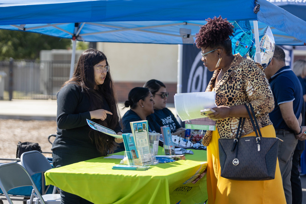 Employer talks with female job seeker