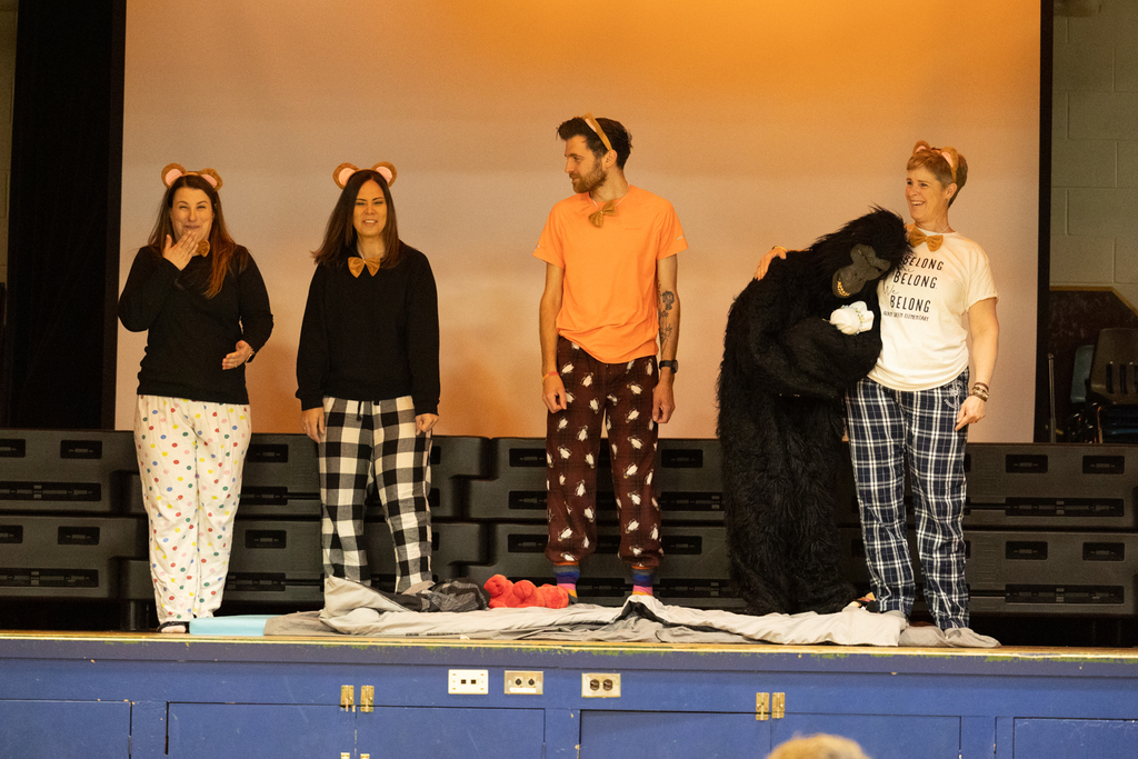 Staff acting in a play