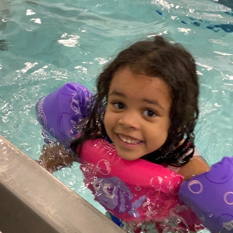 girl enjoying swimming in the pool  