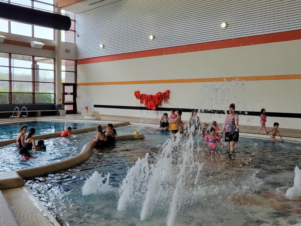 Moms and children swimming