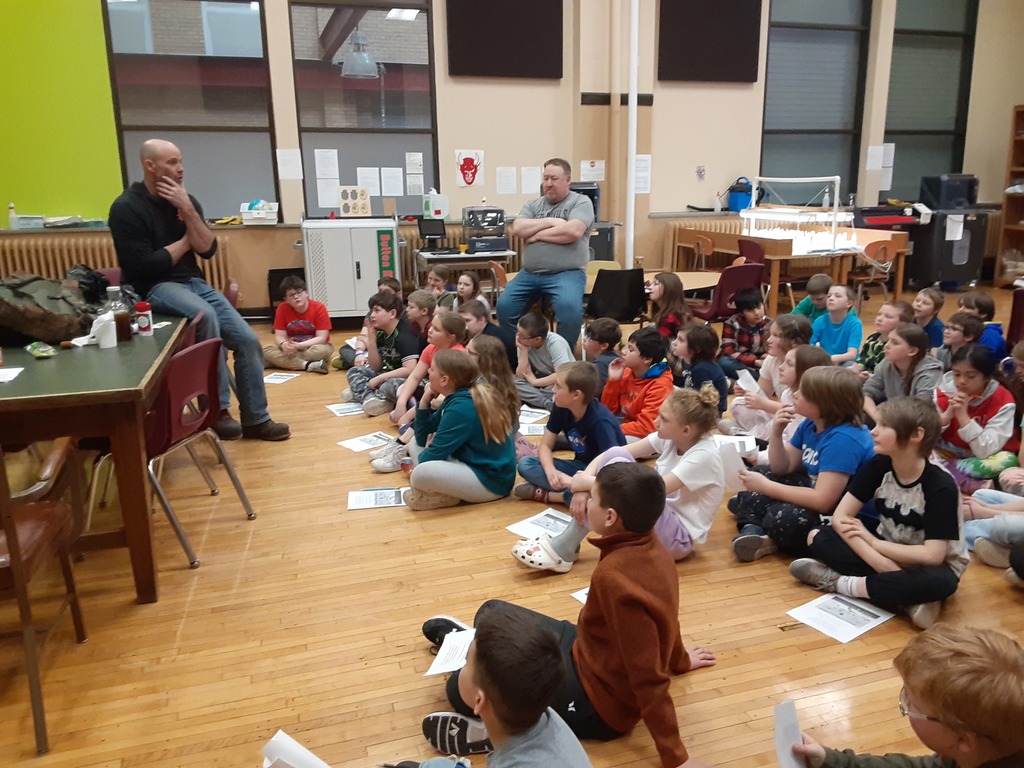 Mr. Foley talks to the 4th grade students about trees