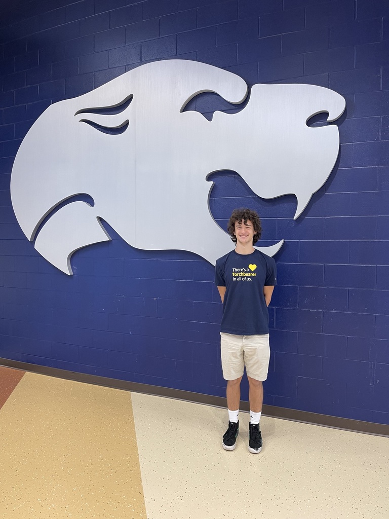 Daden standing in front of the Edgwood Cougar at EHS