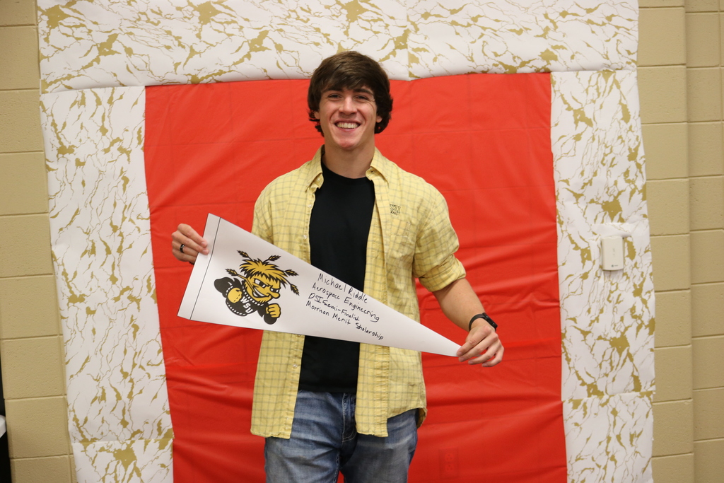 Student signing with WSU