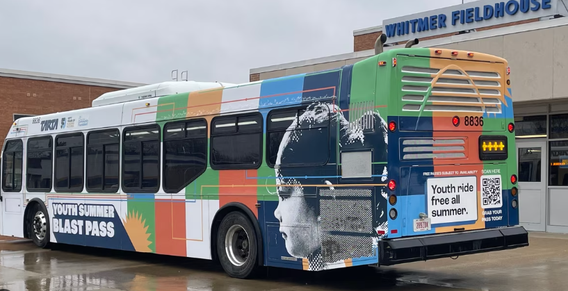 Tarta Bus with logo that says 'Youth ride free all summer"