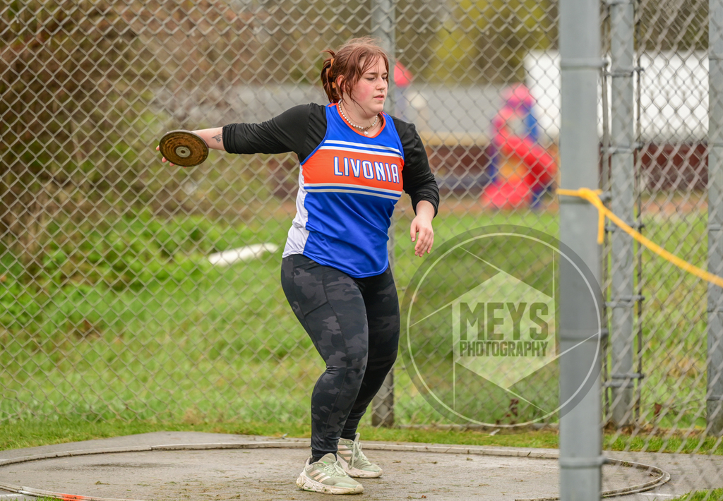 student throwing disc