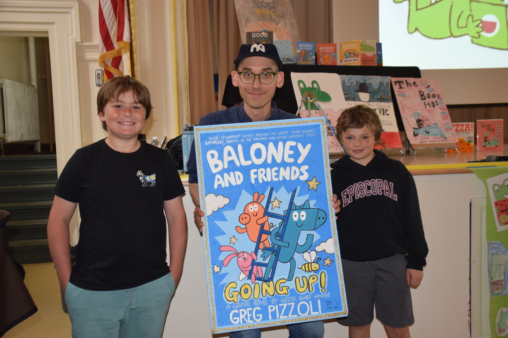 Award winning author and illustrator Greg Pizzoli with Locust Valley Intermediate fourth graders Jack Scheider and William Benazzi who recreated one of the author’s graphic novel covers.
