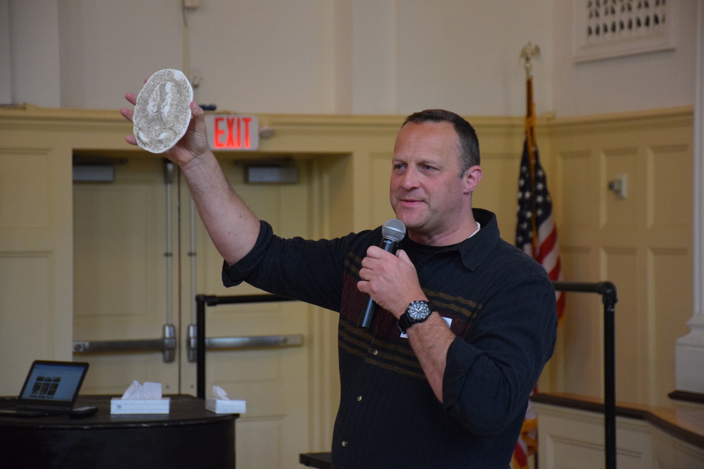 James Bruchac shows Bayville Intermediate students a deer track.