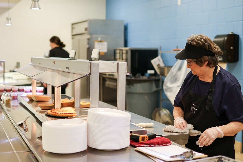A food service worker in the cafeteria